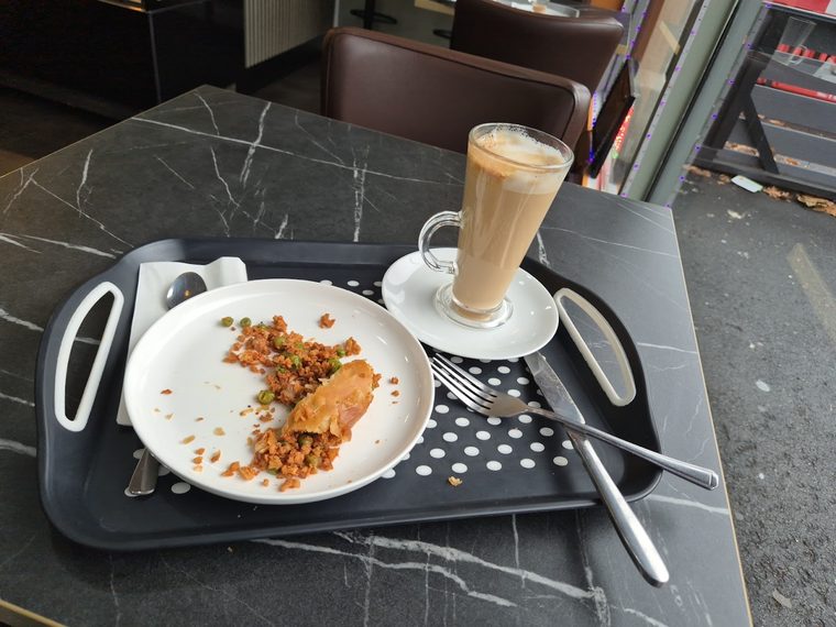 Pastry served with a glass latte